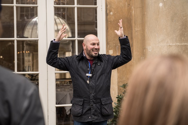 a man standing in front of a building