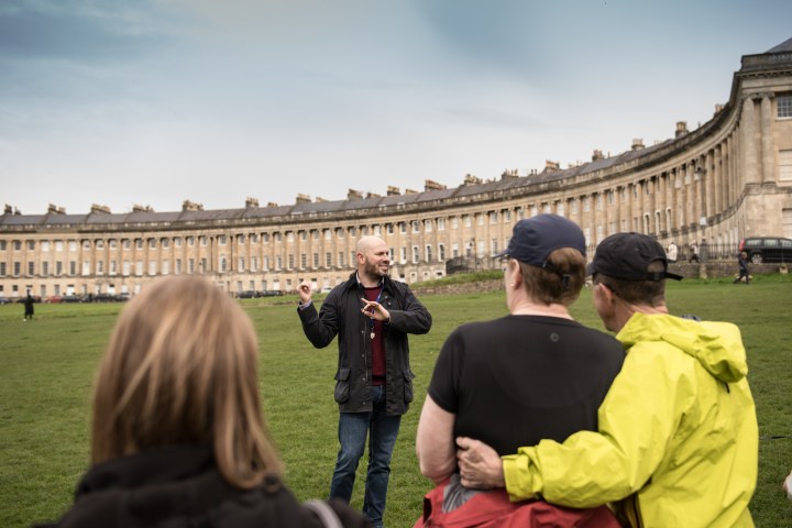 a group of people standing in front of a building