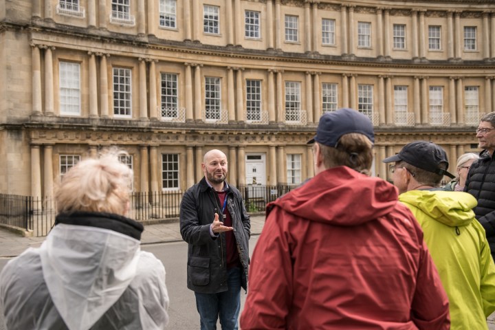 a group of people standing in front of a building