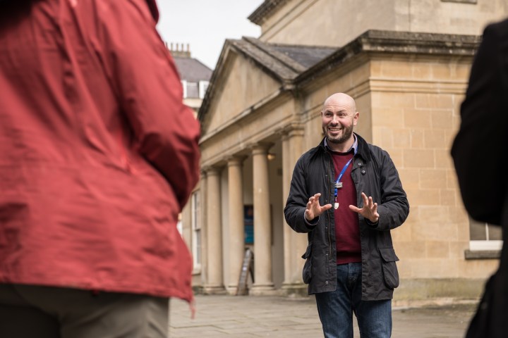 a man and a woman standing on a sidewalk