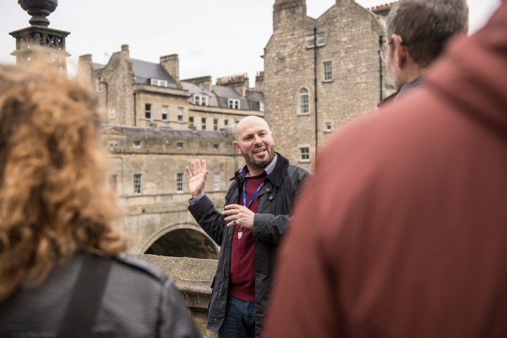 a group of people standing in front of a building