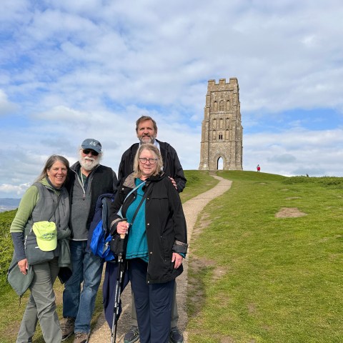 a group of people standing in a field
