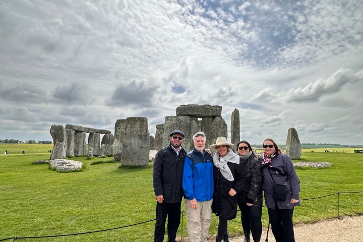 a group of people standing in a field