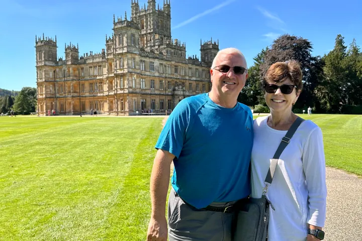 a man that is standing in the grass