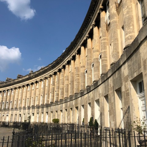 a large building with Royal Crescent in the background