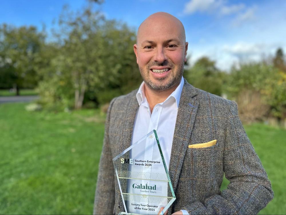 Matthias Kurth of Galahad Tours holding an award trophy